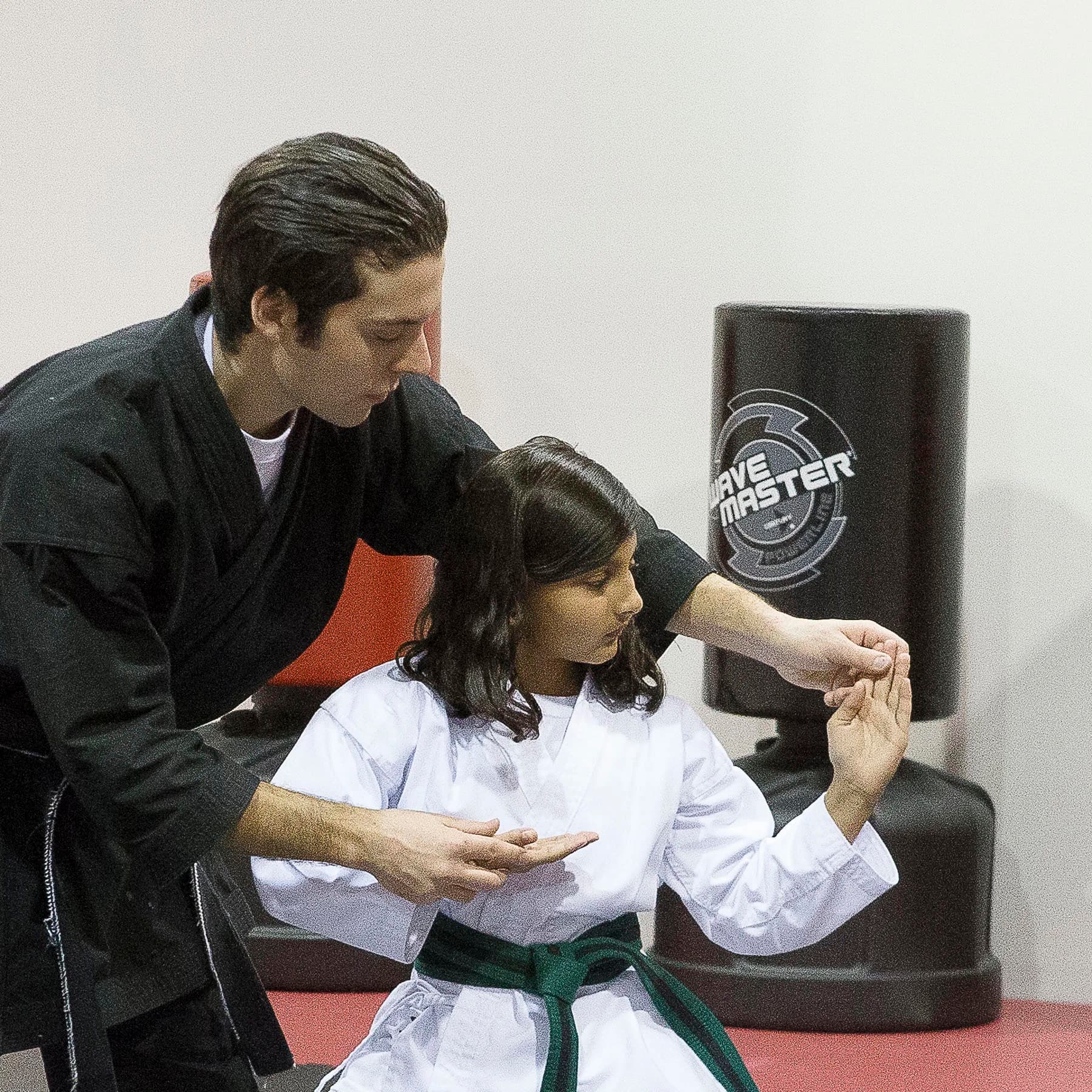 Instructor teaching a blocking technique